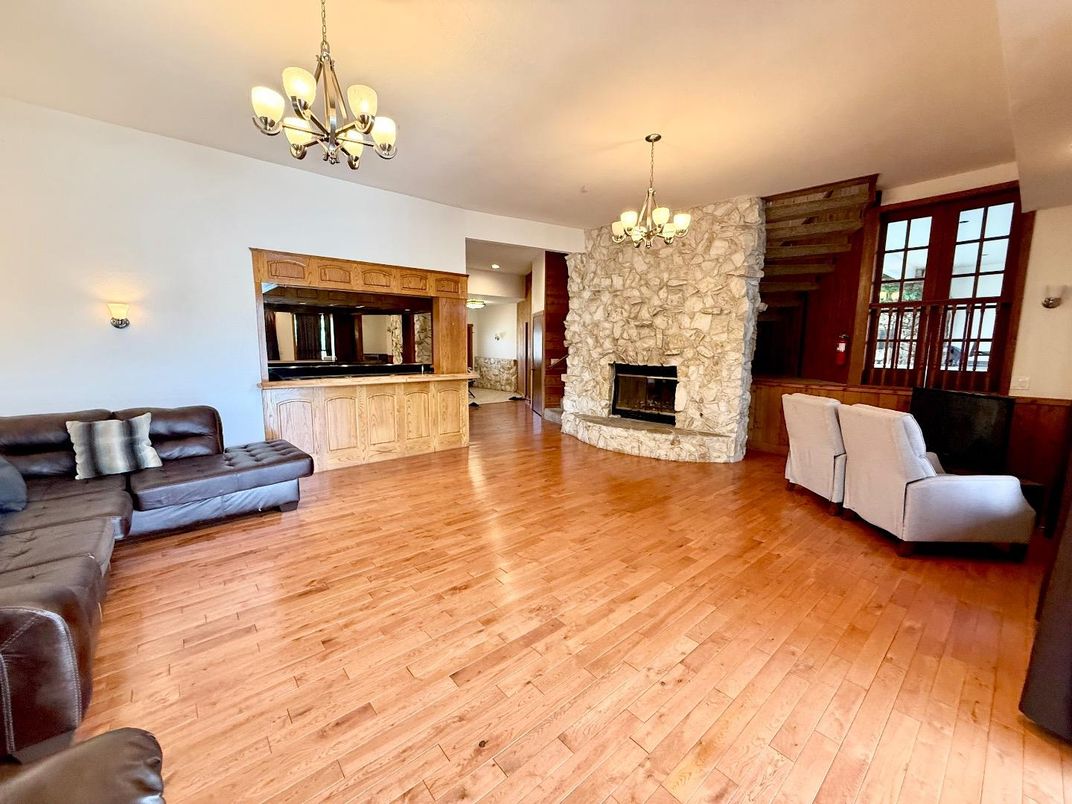 Chandelier, Fireplace, Interior, Living room, Recessed Lighting, Wood Texture Flooring