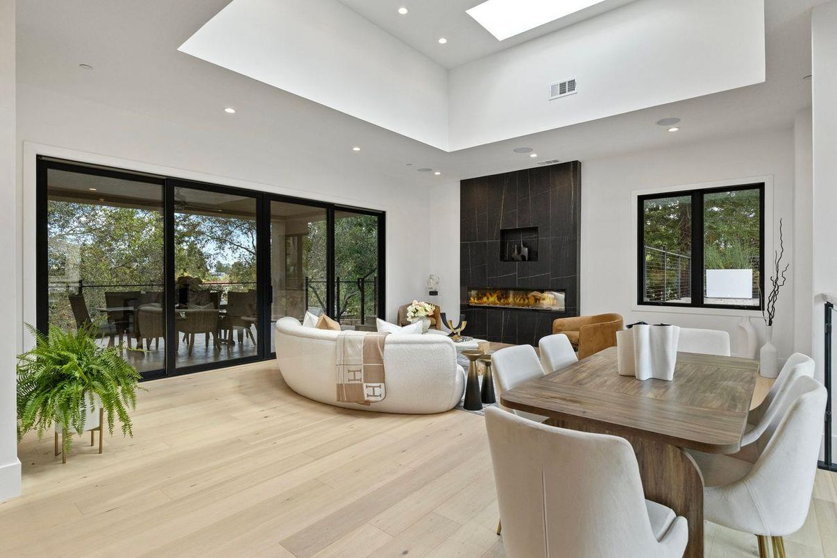 Dining room, Fireplace, Interior, Living room, Recessed Lighting, Wood Texture Flooring