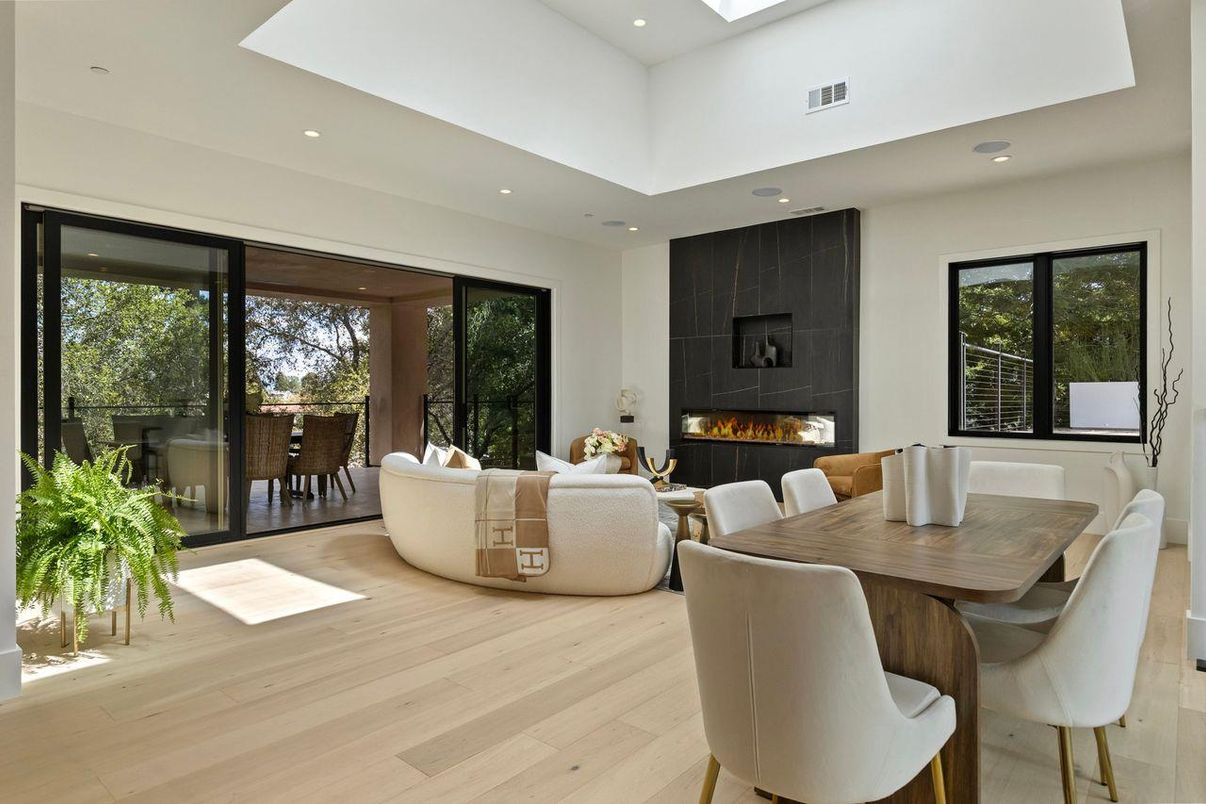 Dining room, Fireplace, Interior, Living room, Recessed Lighting, Wood Texture Flooring