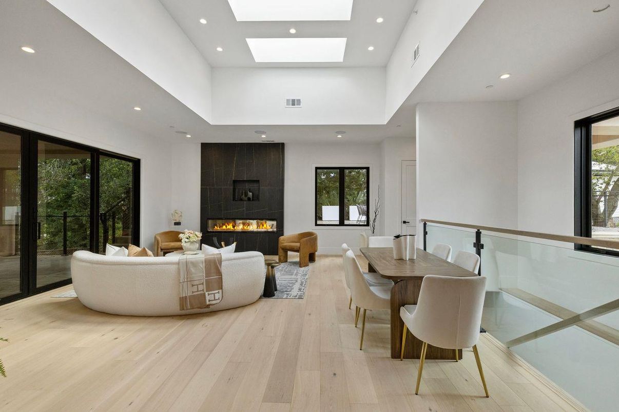 Dining room, Fireplace, Interior, Living room, Recessed Lighting, Wood Texture Flooring