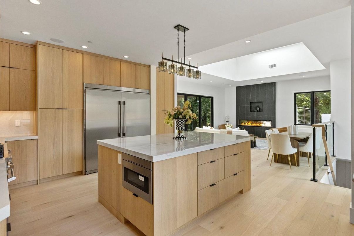 Dining room, Fireplace, Interior, Kitchen, Living room, Pendant Lights, Recessed Lighting, Stainless Steel Appliances, Wood Texture Flooring