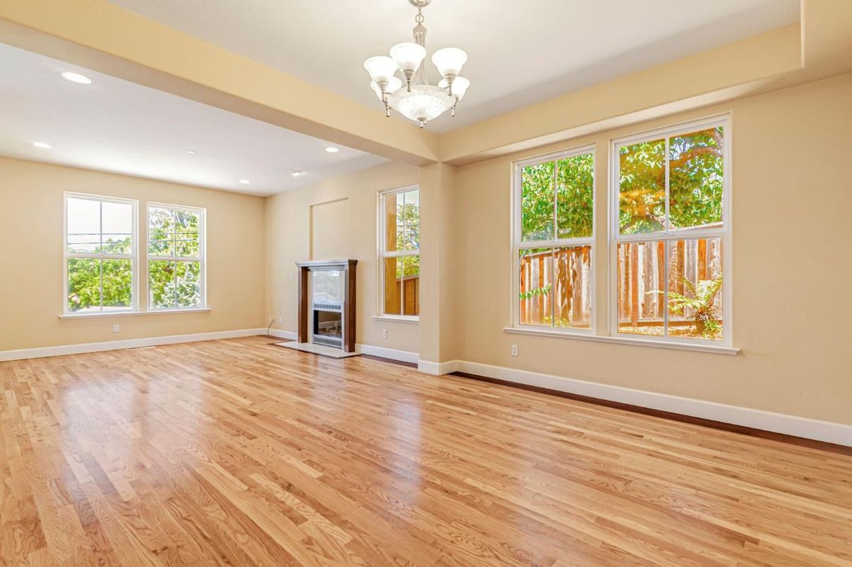 Chandelier, Empty room, Fireplace, Interior, Recessed Lighting, Wood Texture Flooring