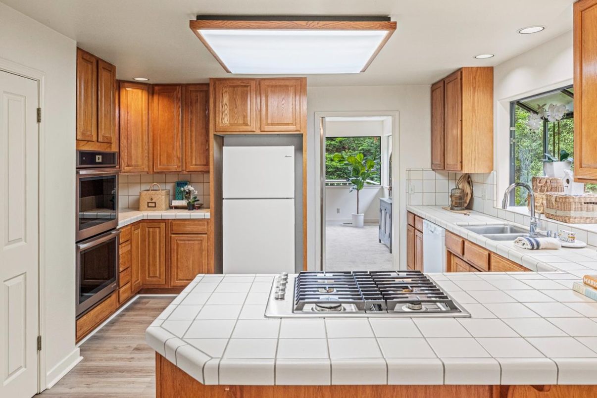 Interior, Kitchen, Recessed Lighting, Tile Countertops, Wood Texture Flooring