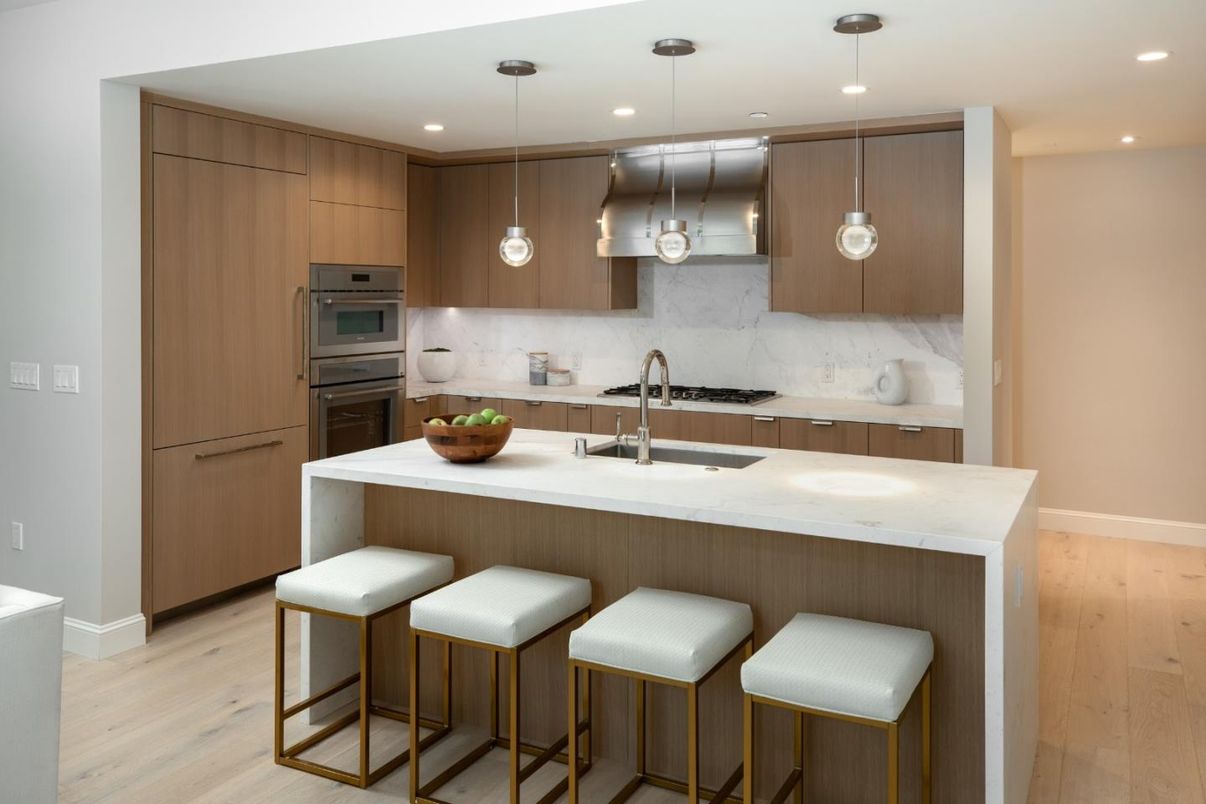 Interior, Kitchen, Marble Walls, Pendant Lights, Recessed Lighting, Stainless Steel Appliances, Wood Texture Flooring