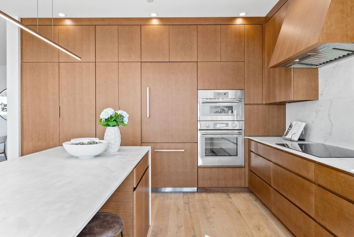 Interior, Kitchen, Marble Walls, Recessed Lighting, Stainless Steel Appliances, Wood Texture Flooring