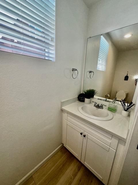 Bathroom, Dual Sink Vanities, Interior, Recessed Lighting, Wood Texture Flooring
