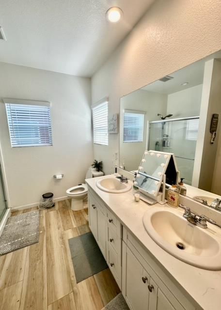 Bathroom, Dual Sink Vanities, Glass Shower, Interior, Recessed Lighting, Wood Texture Flooring