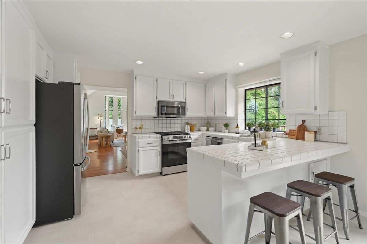 Interior, Kitchen, Recessed Lighting, Stainless Steel Appliances, Tile Countertops, Wood Texture Flooring