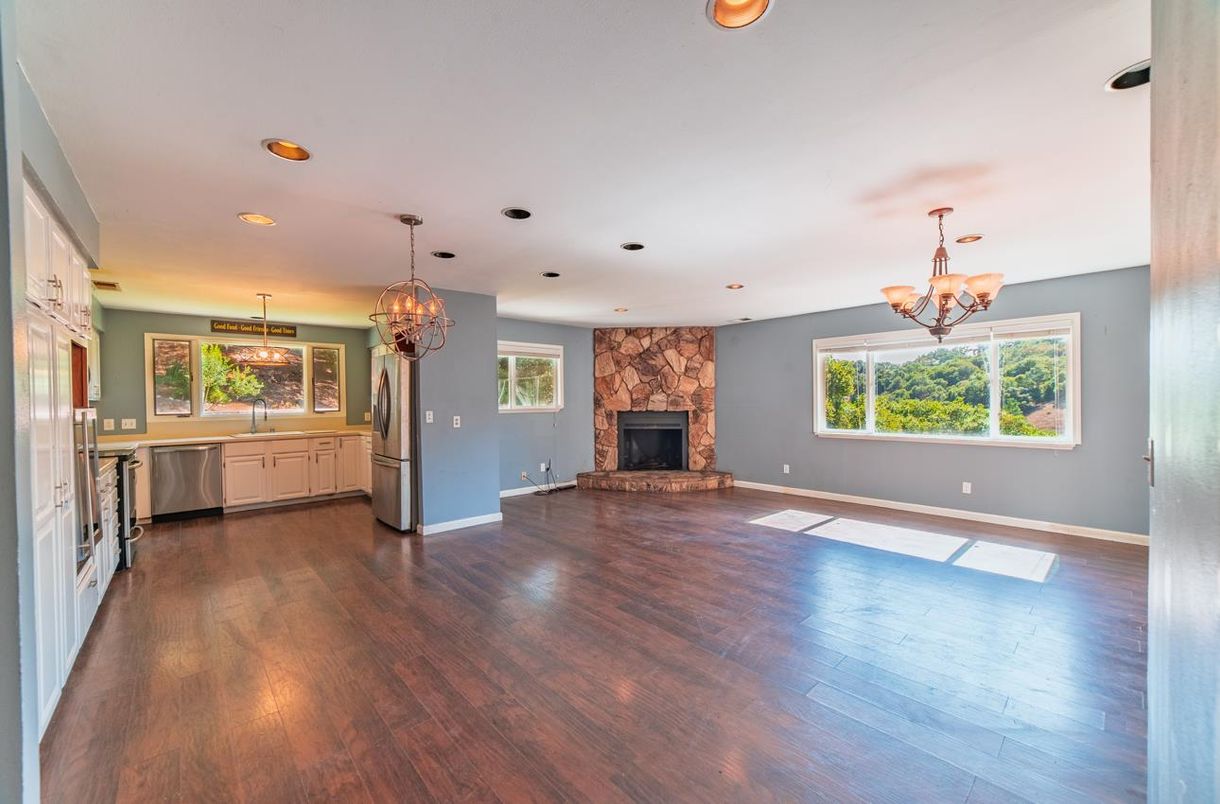 Chandelier, Empty room, Fireplace, Interior, Kitchen, Recessed Lighting, Wood Texture Flooring