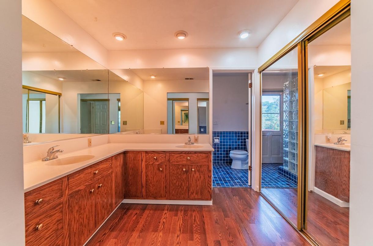 Bathroom, Dual Sink Vanities, Glass Shower, Interior, Recessed Lighting, Wood Texture Flooring