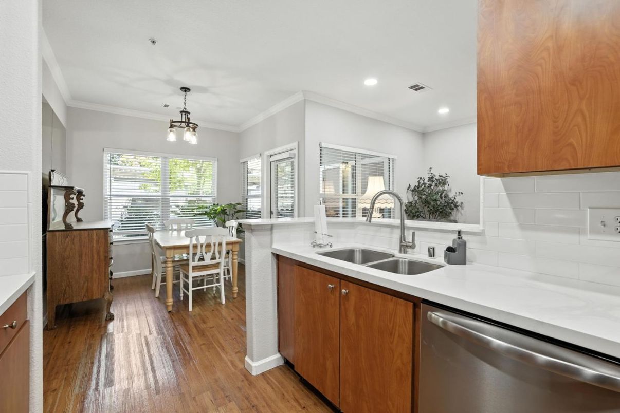 Dining room, Interior, Kitchen, Pendant Lights, Recessed Lighting, Stainless Steel Appliances, Wood Texture Flooring