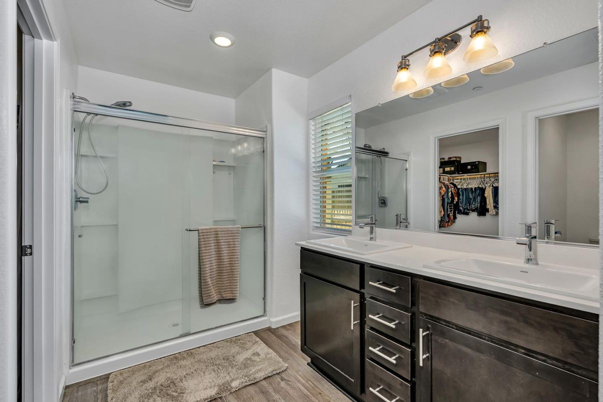 Bathroom, Dual Sink Vanities, Glass Shower, Interior, Recessed Lighting, Walk-in Closets, Wood Texture Flooring