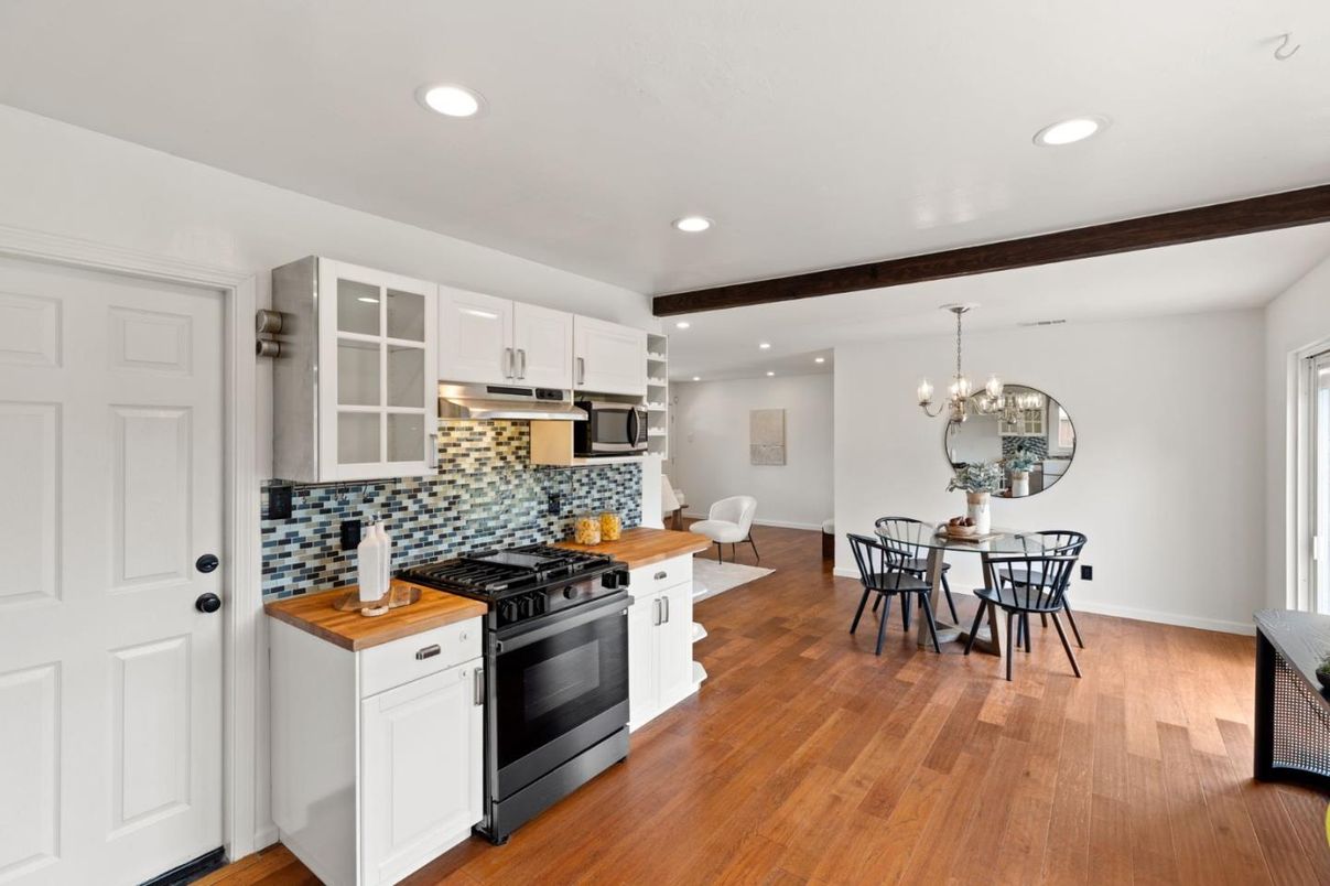 Chandelier, Dining room, Interior, Kitchen, Recessed Lighting, Stainless Steel Appliances, Wood Texture Flooring