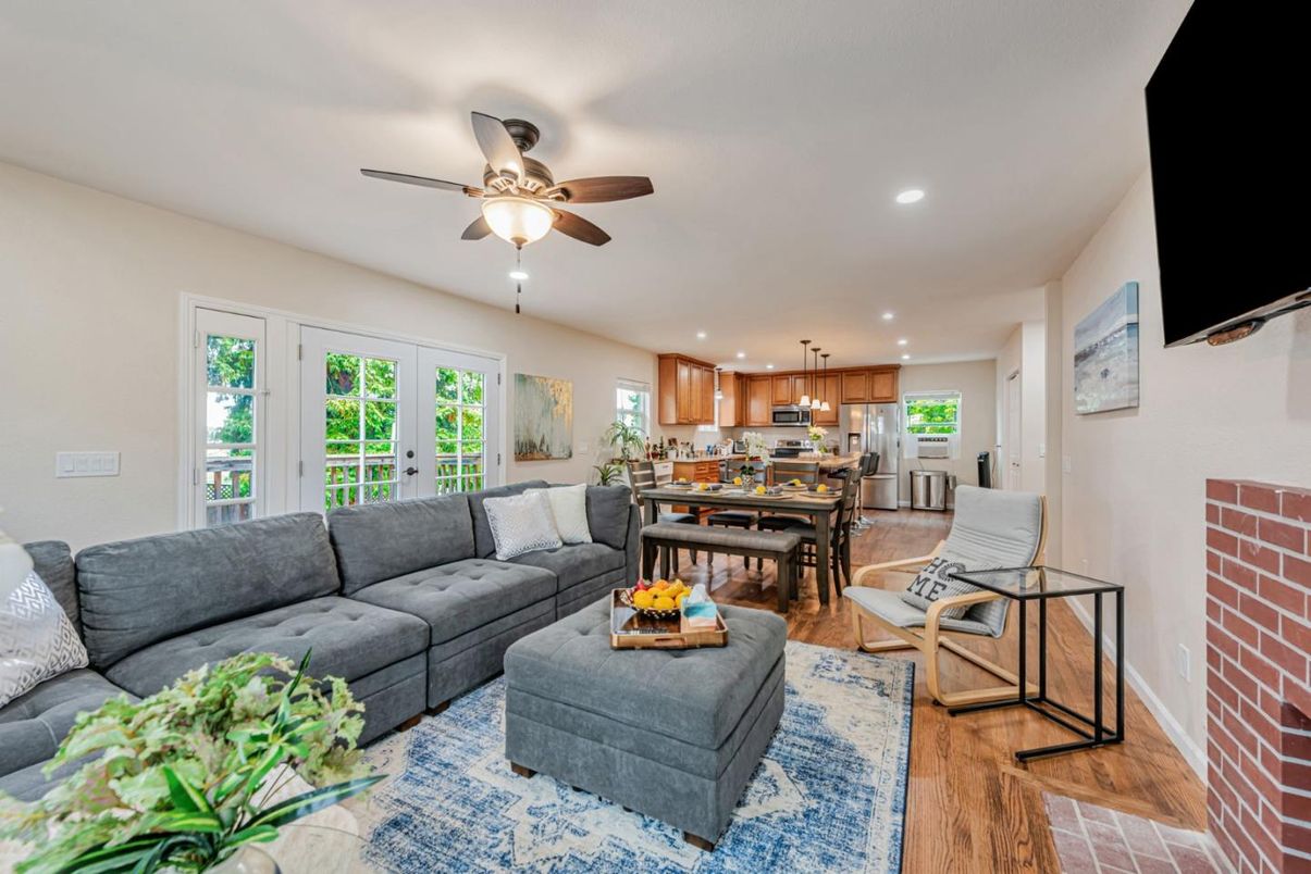 Dining room, Interior, Kitchen, Living room, Recessed Lighting, Stainless Steel Appliances, Stone Walls, Wood Texture Flooring