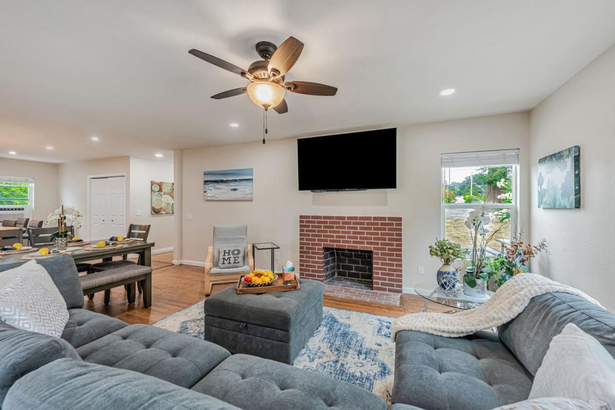 Dining room, Fireplace, Interior, Living room, Recessed Lighting, Wood Texture Flooring