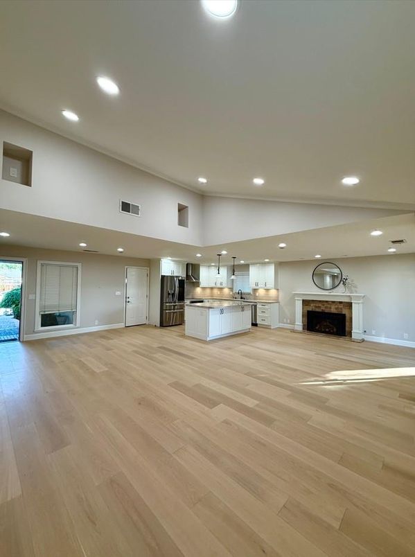 Empty room, Fireplace, Interior, Kitchen, Pendant Lights, Recessed Lighting, Wood Texture Flooring