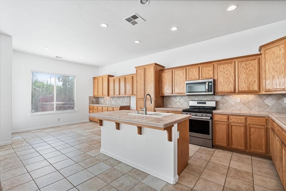 Interior, Kitchen, Recessed Lighting, Tile Countertops, Wooden Ceilings