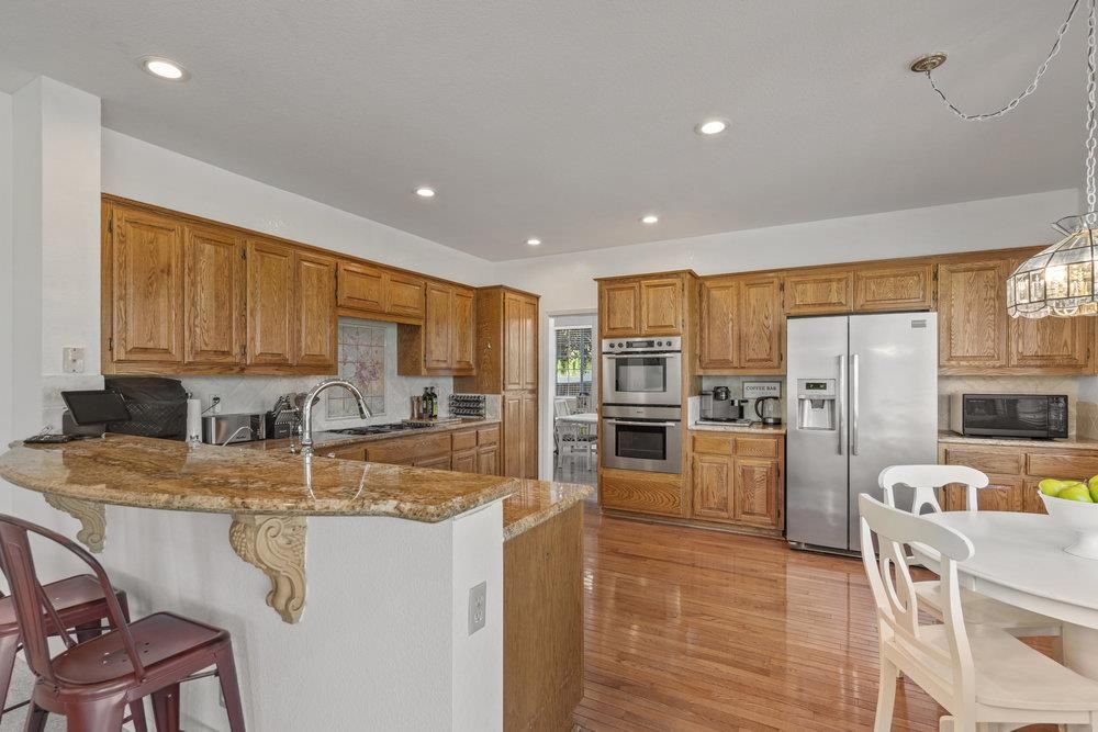 Dining room, Interior, Kitchen, Recessed Lighting, Stainless Steel Appliances, Wood Texture Flooring