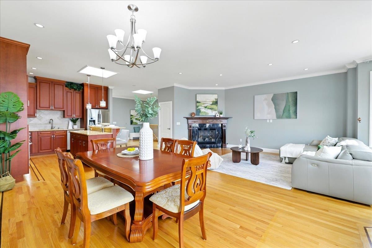 Chandelier, Dining room, Fireplace, Interior, Kitchen, Living room, Recessed Lighting, Wood Texture Flooring
