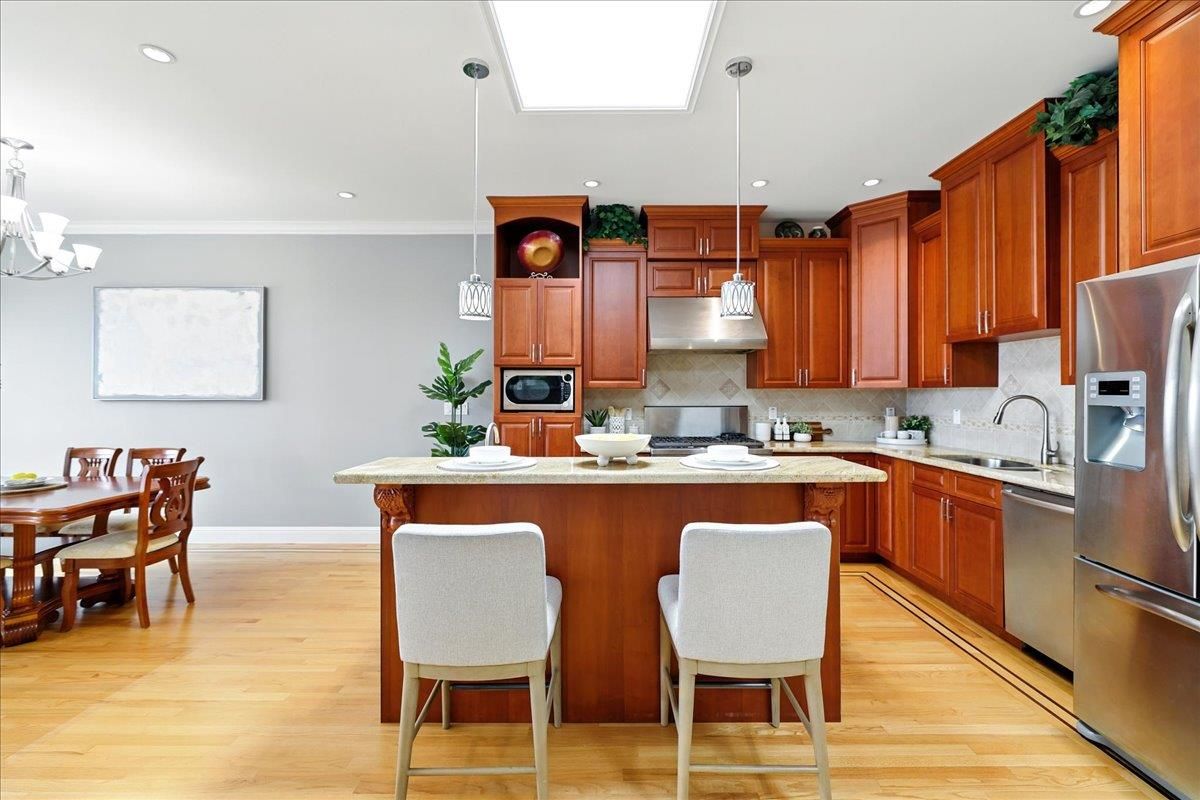 Dining room, Interior, Kitchen, Pendant Lights, Recessed Lighting, Stainless Steel Appliances, Wood Texture Flooring