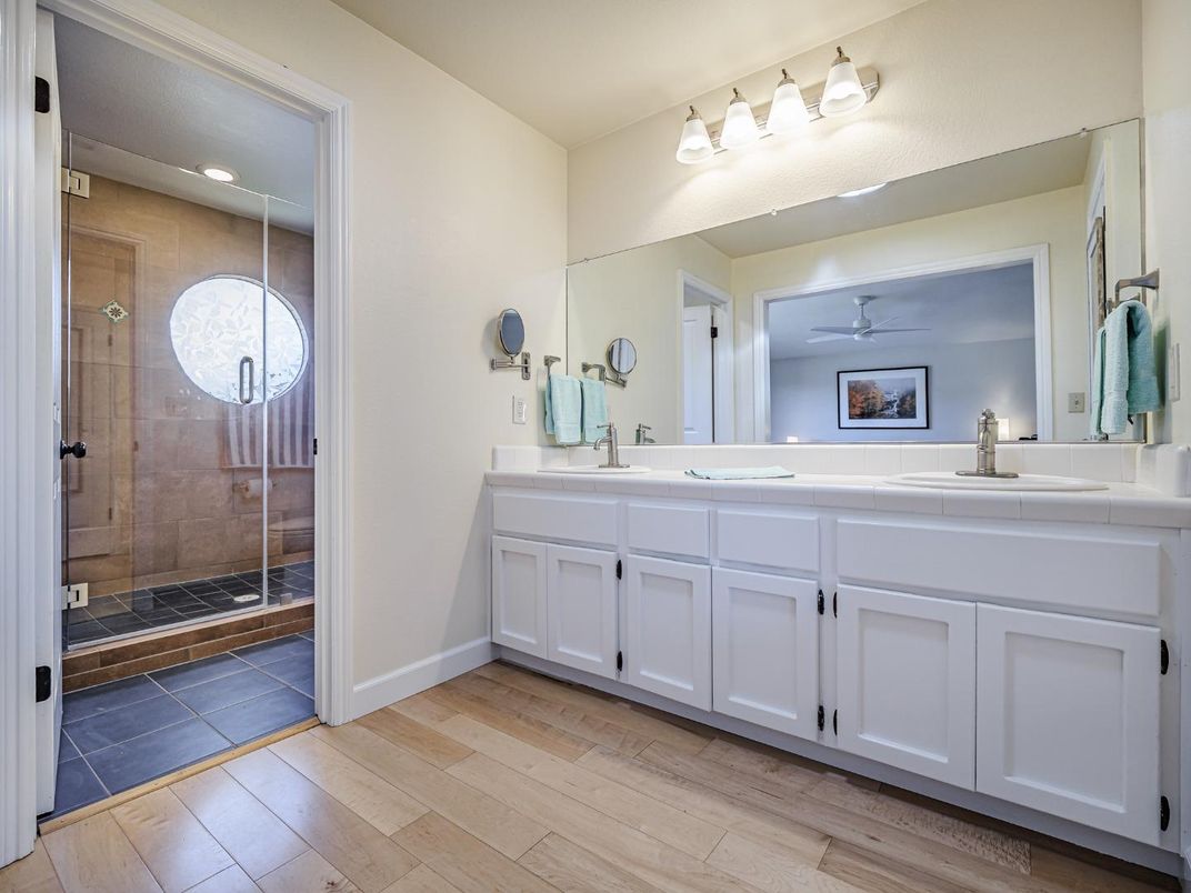 Bathroom, Dual Sink Vanities, Glass Shower, Interior, Tile Countertops, Wood Texture Flooring