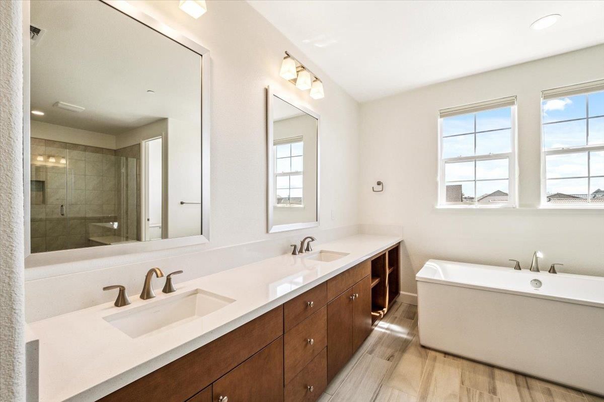 Bathroom, Dual Sink Vanities, Free Standing Baths, Glass Shower, Interior, Recessed Lighting, Wood Texture Flooring