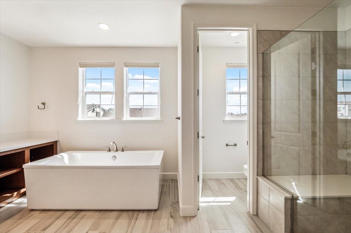Bathroom, Free Standing Baths, Glass Shower, Interior, Recessed Lighting, Wood Texture Flooring