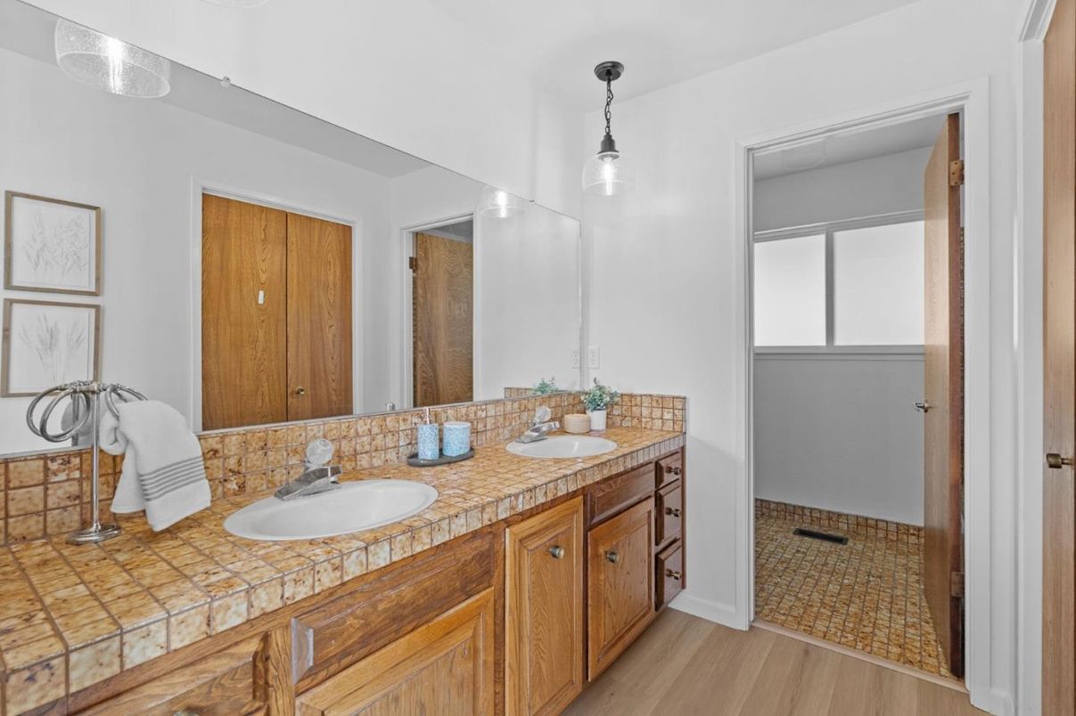 Bathroom, Dual Sink Vanities, Interior, Pendant Lights, Tile Countertops, Wood Texture Flooring