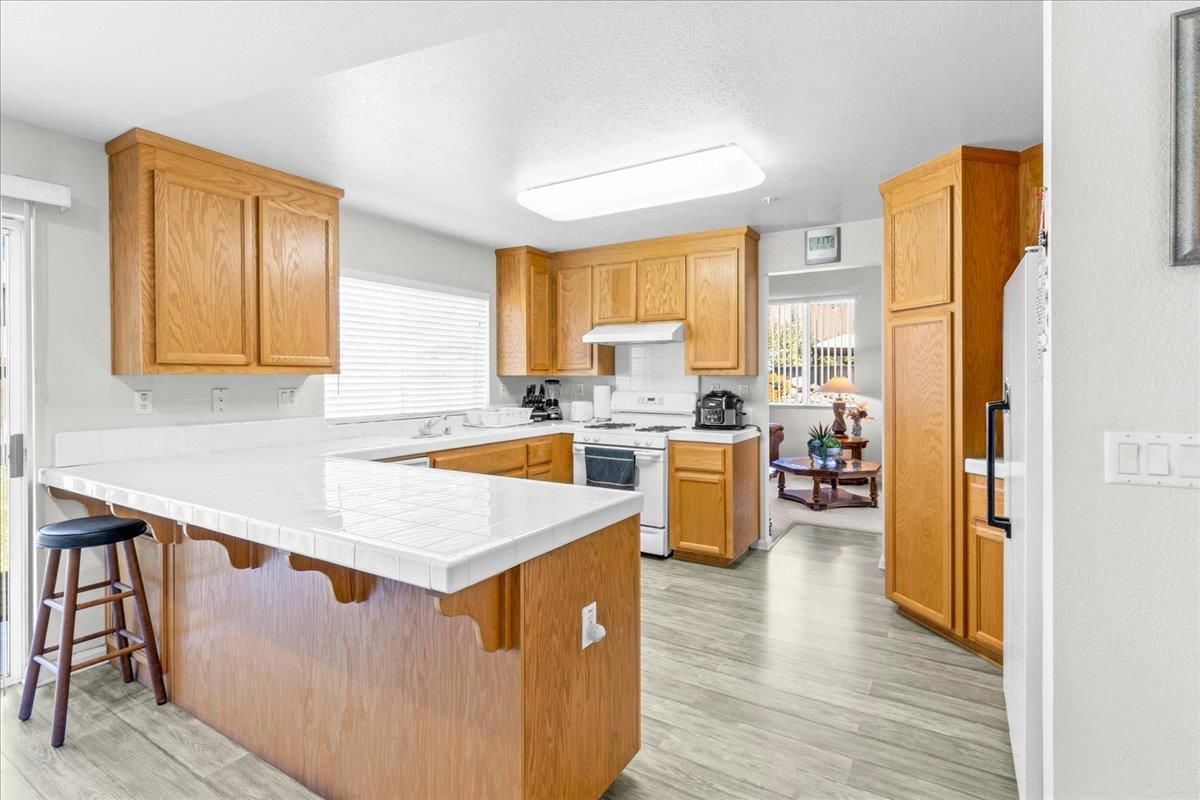 Interior, Kitchen, Tile Countertops, Wood Texture Flooring