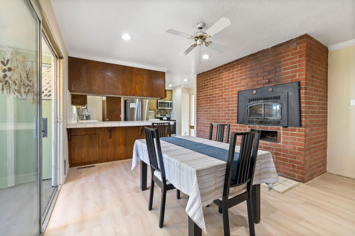 Dining room, Fireplace, Interior, Kitchen, Recessed Lighting, Stone Walls, Wood Texture Flooring