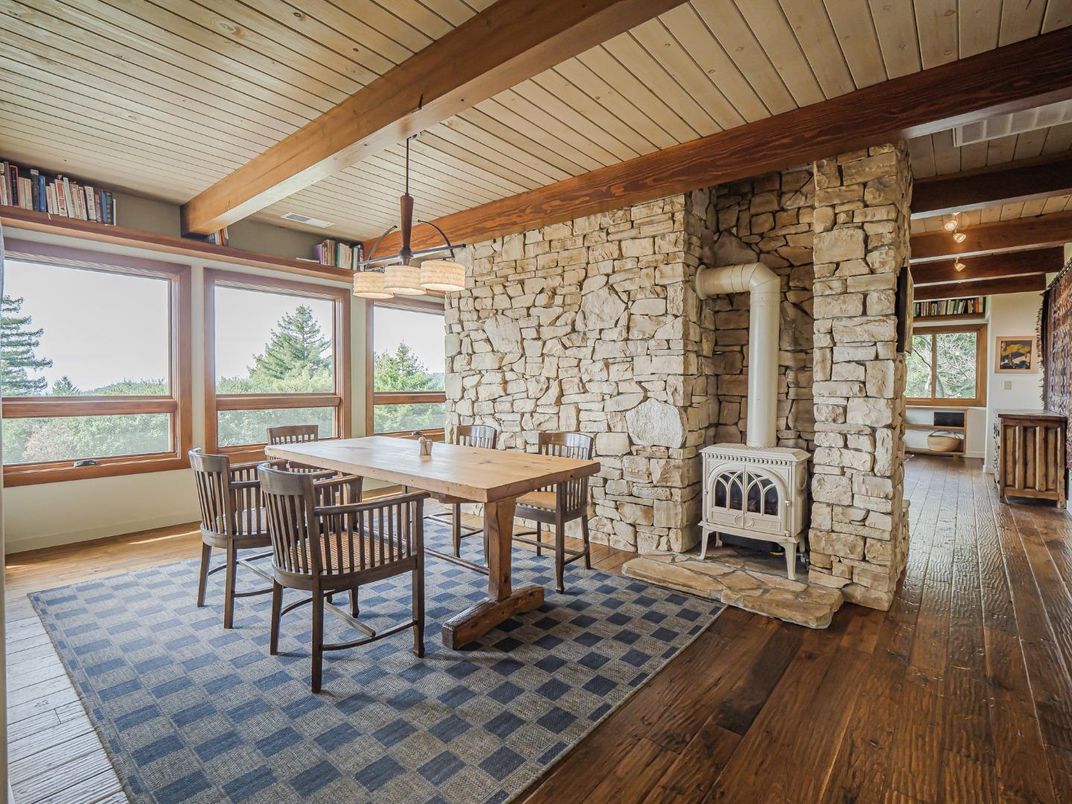 Dining room, Fireplace, Interior, Stone Walls, Wooden Beams, Wood Texture Flooring