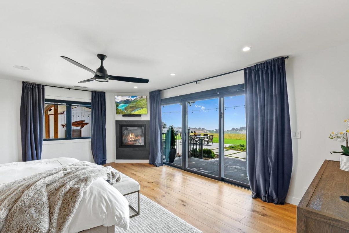 Bedroom, Fireplace, Interior, Recessed Lighting, Water, Wood Texture Flooring