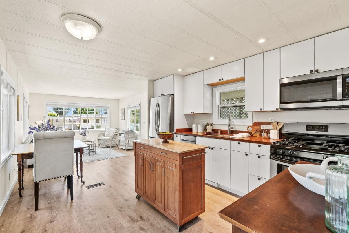Dining room, Interior, Kitchen, Living room, Recessed Lighting, Stainless Steel Appliances, Wood Texture Flooring