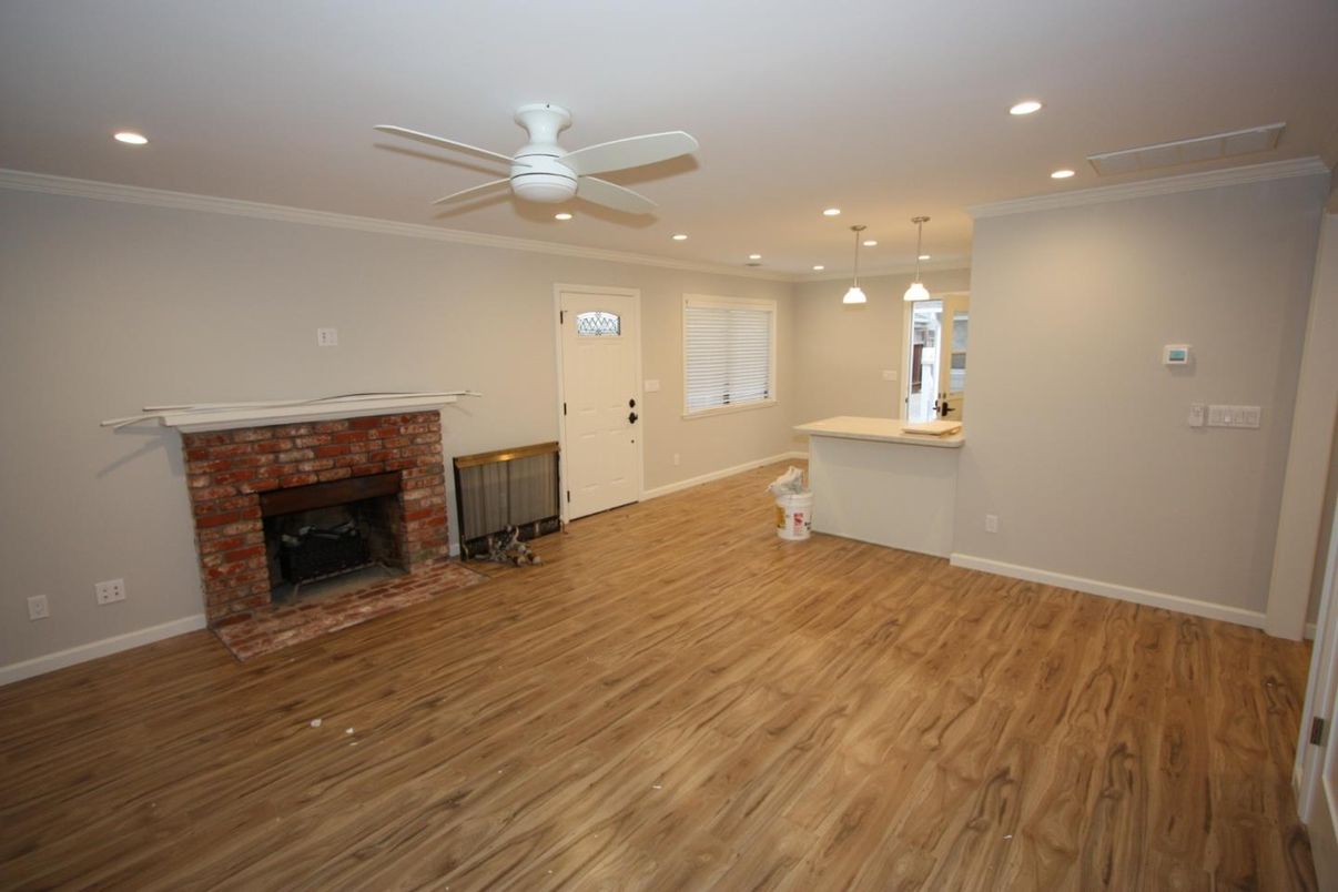 Empty room, Fireplace, Interior, Pendant Lights, Recessed Lighting, Wood Texture Flooring