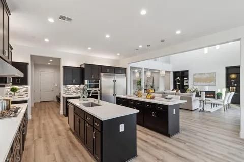 Dining room, Fireplace, Interior, Kitchen, Living room, Pendant Lights, Recessed Lighting, Stainless Steel Appliances, Wood Texture Flooring