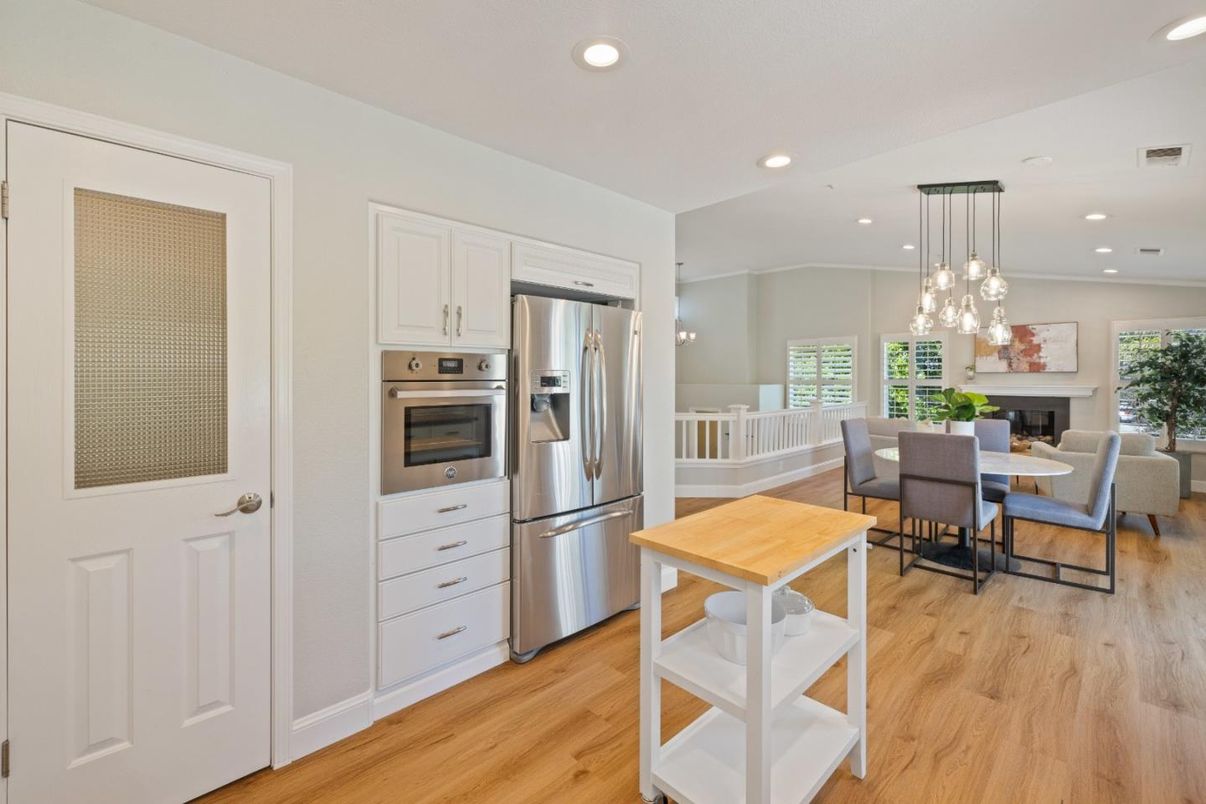 Dining room, Interior, Kitchen, Pendant Lights, Recessed Lighting, Stainless Steel Appliances, Wood Texture Flooring