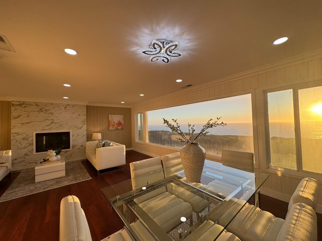 Dining room, Fireplace, Interior, Living room, Recessed Lighting, Water, Wood Texture Flooring
