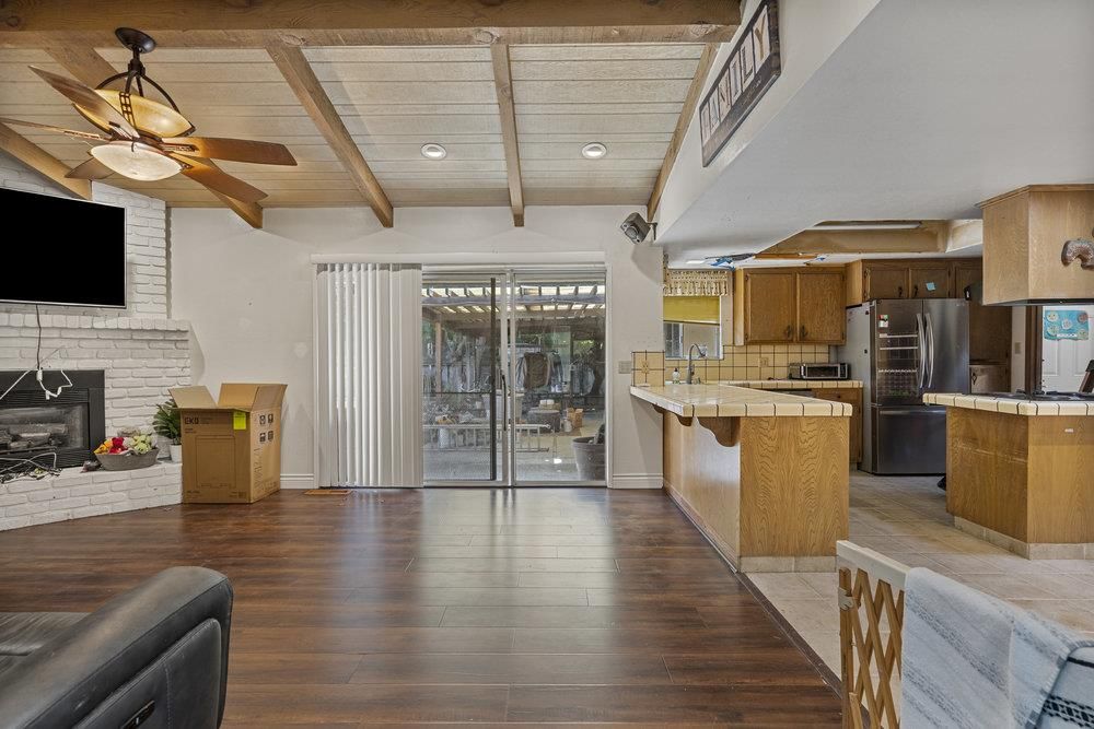 Fireplace, Interior, Kitchen, Recessed Lighting, Stainless Steel Appliances, Stone Walls, Tile Countertops, Wooden Beams, Wooden Ceilings, Wood Texture Flooring