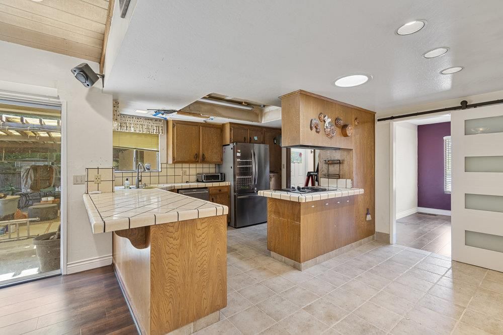 Interior, Kitchen, Recessed Lighting, Tile Countertops, Wood Texture Flooring