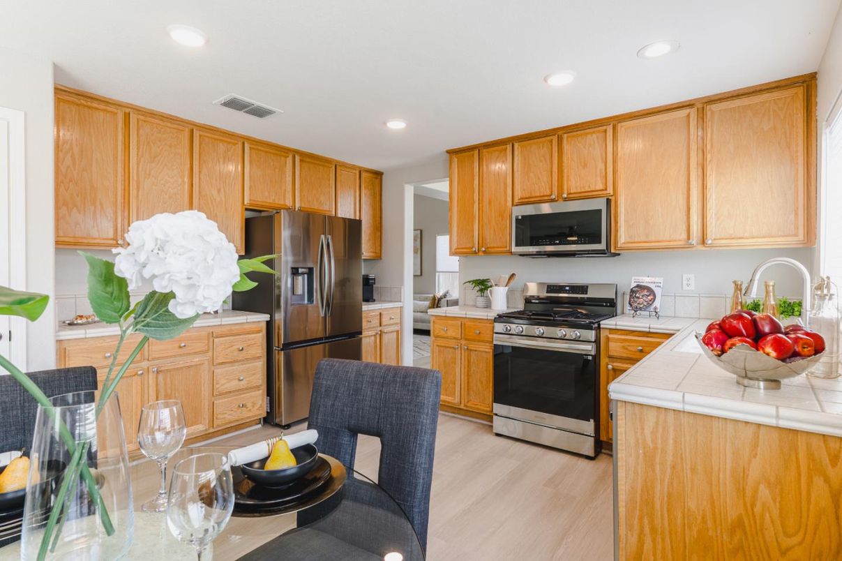 Interior, Kitchen, Recessed Lighting, Stainless Steel Appliances, Tile Countertops, Wood Texture Flooring