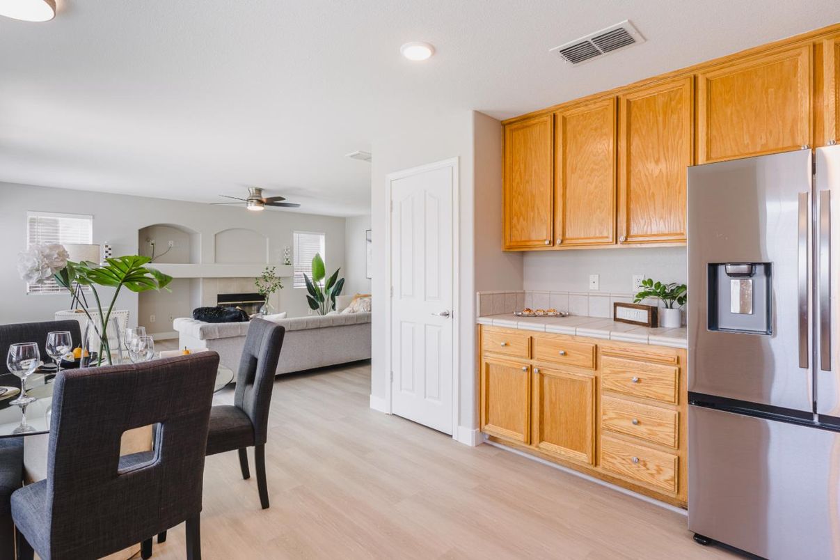 Dining room, Fireplace, Interior, Kitchen, Living room, Recessed Lighting, Tile Countertops, Wood Texture Flooring