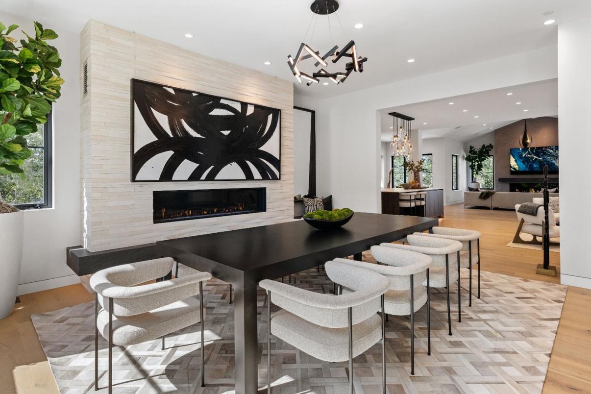 Chandelier, Dining room, Fireplace, Interior, Living room, Pendant Lights, Recessed Lighting, Wood Texture Flooring