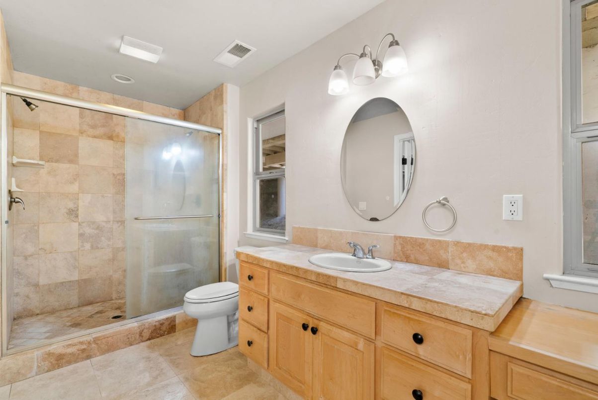 Bathroom, Dual Sink Vanities, Glass Shower, Interior, Recessed Lighting, Tile Countertops