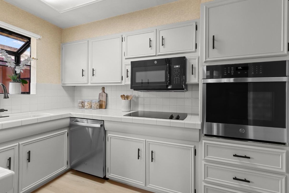 Interior, Kitchen, Stainless Steel Appliances, Tile Countertops, Wood Texture Flooring