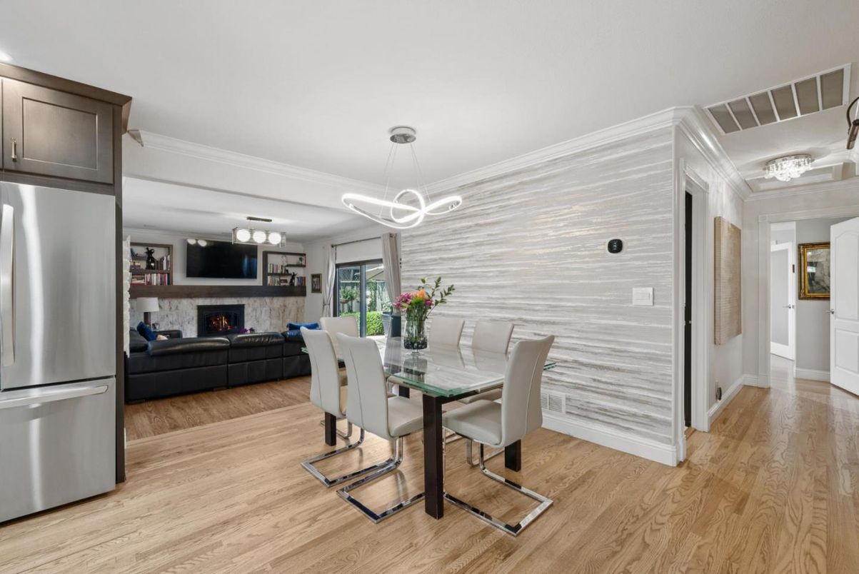 Dining room, Fireplace, Interior, Kitchen, Living room, Pendant Lights, Stainless Steel Appliances, Wood Texture Flooring