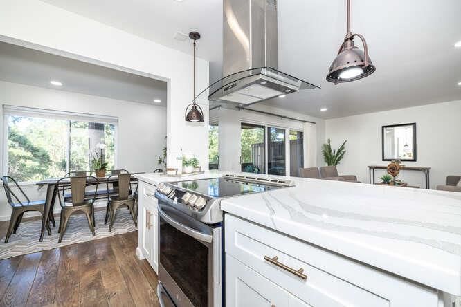 Dining room, Interior, Kitchen, Pendant Lights, Recessed Lighting, Stainless Steel Appliances, Wood Texture Flooring