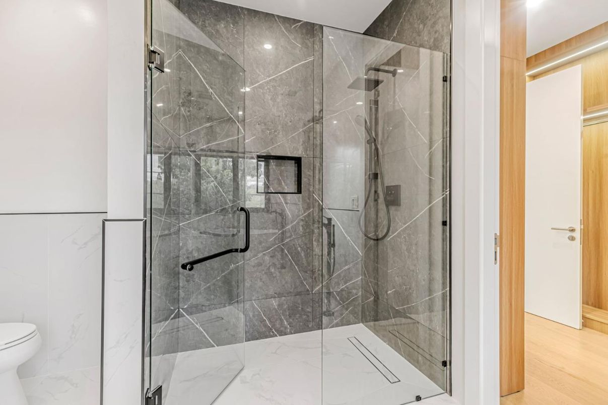 Bathroom, Glass Shower, Interior, Marble, Marble Walls, Recessed Lighting, Wood Texture Flooring