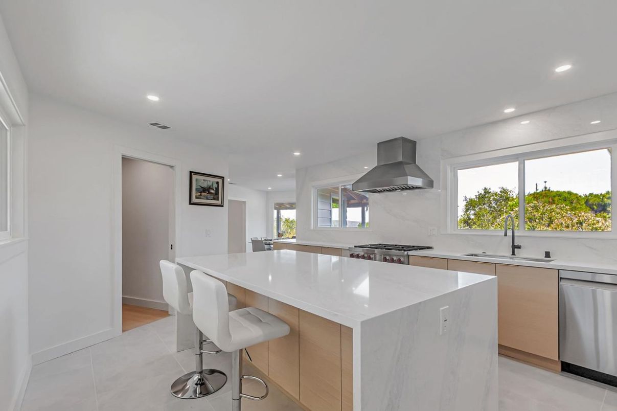 Interior, Kitchen, Marble Walls, Recessed Lighting, Stainless Steel Appliances