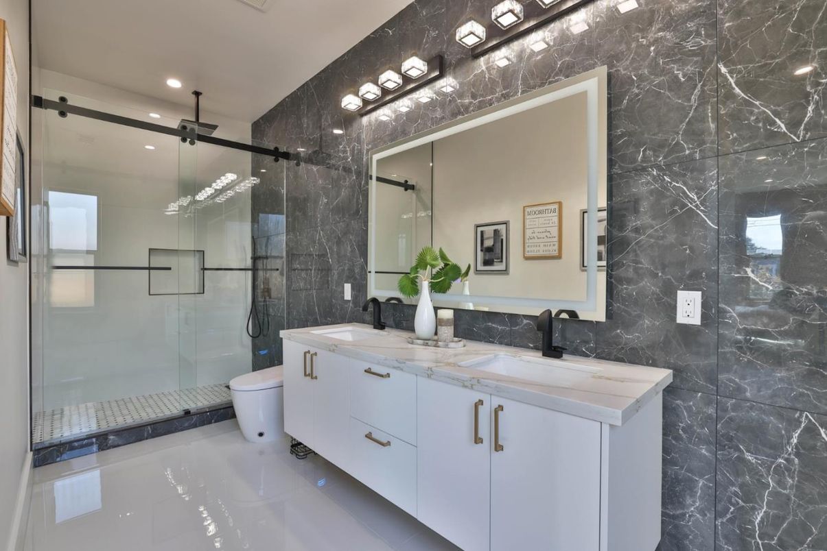 Bathroom, Dual Sink Vanities, Glass Shower, Interior, Marble Walls, Recessed Lighting