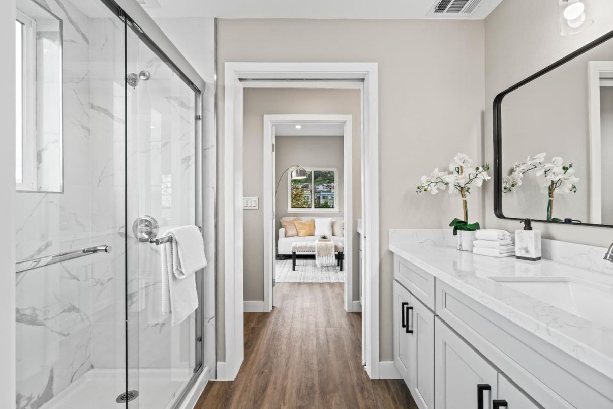 Bathroom, Bedroom, Dual Sink Vanities, Glass Shower, Interior, Marble Walls, Recessed Lighting, Wood Texture Flooring